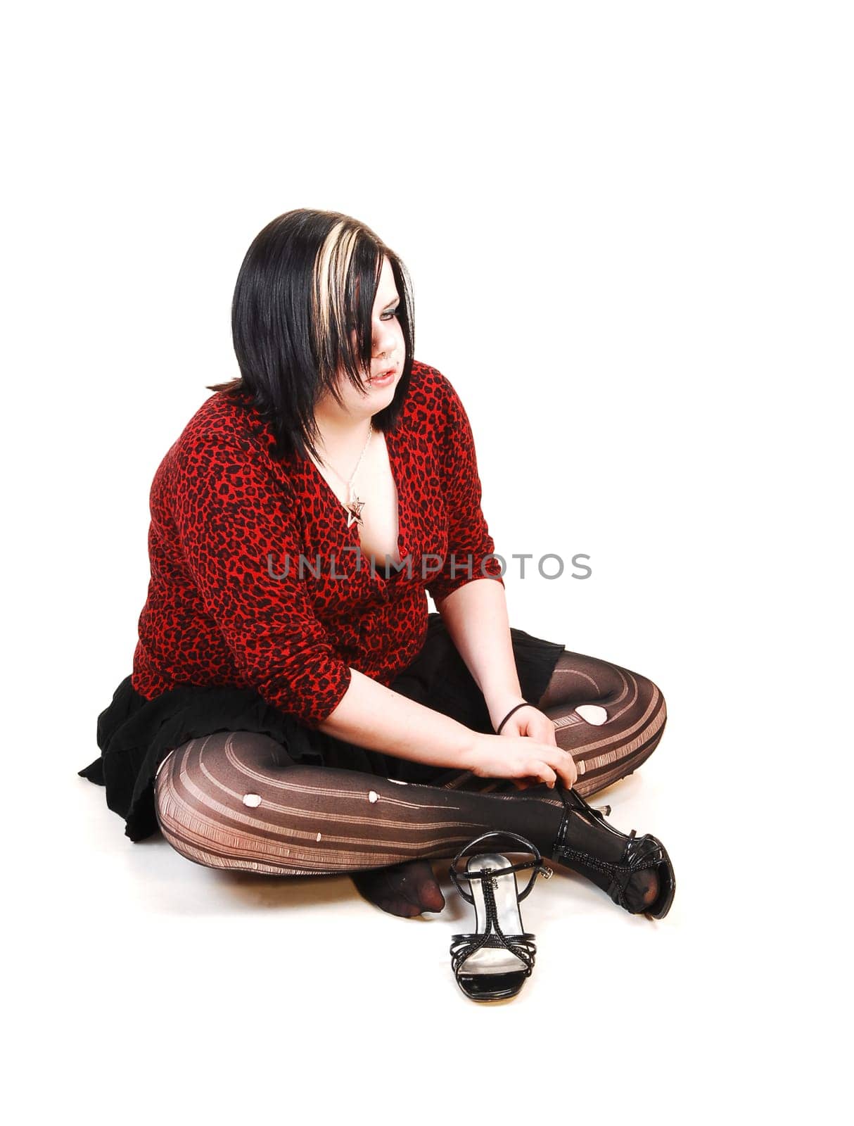 Girl sitting on floor.