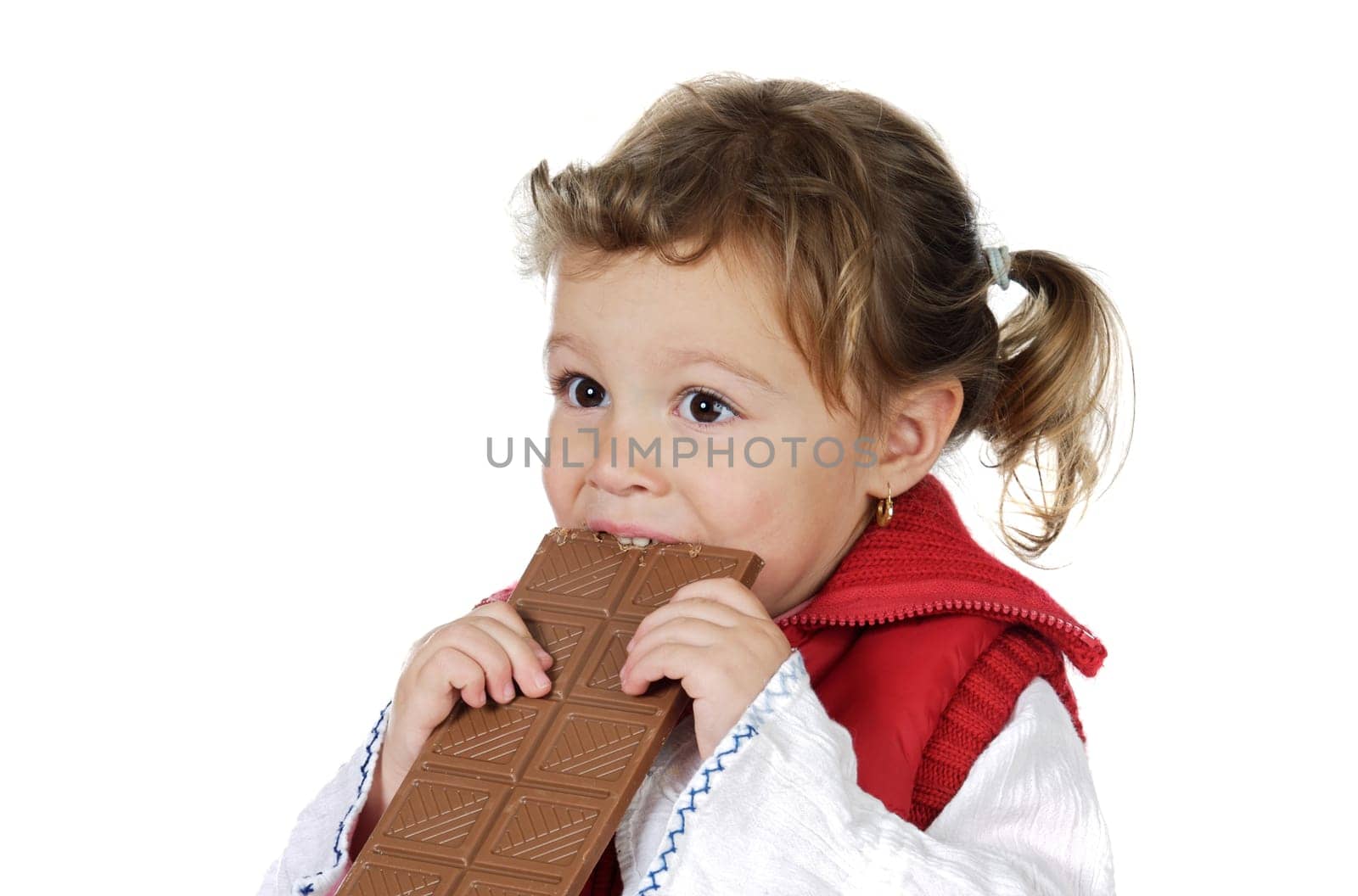 Adorable girl eating chocolate