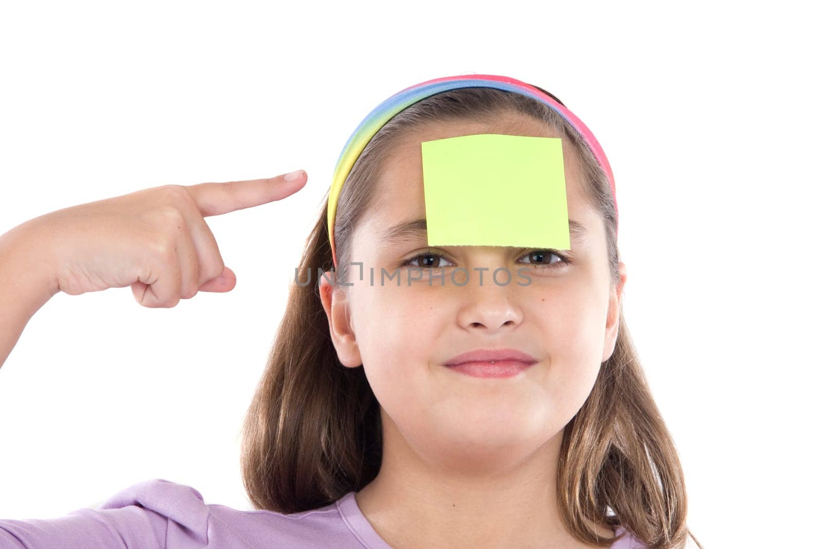 Adorable girl with a note in her front