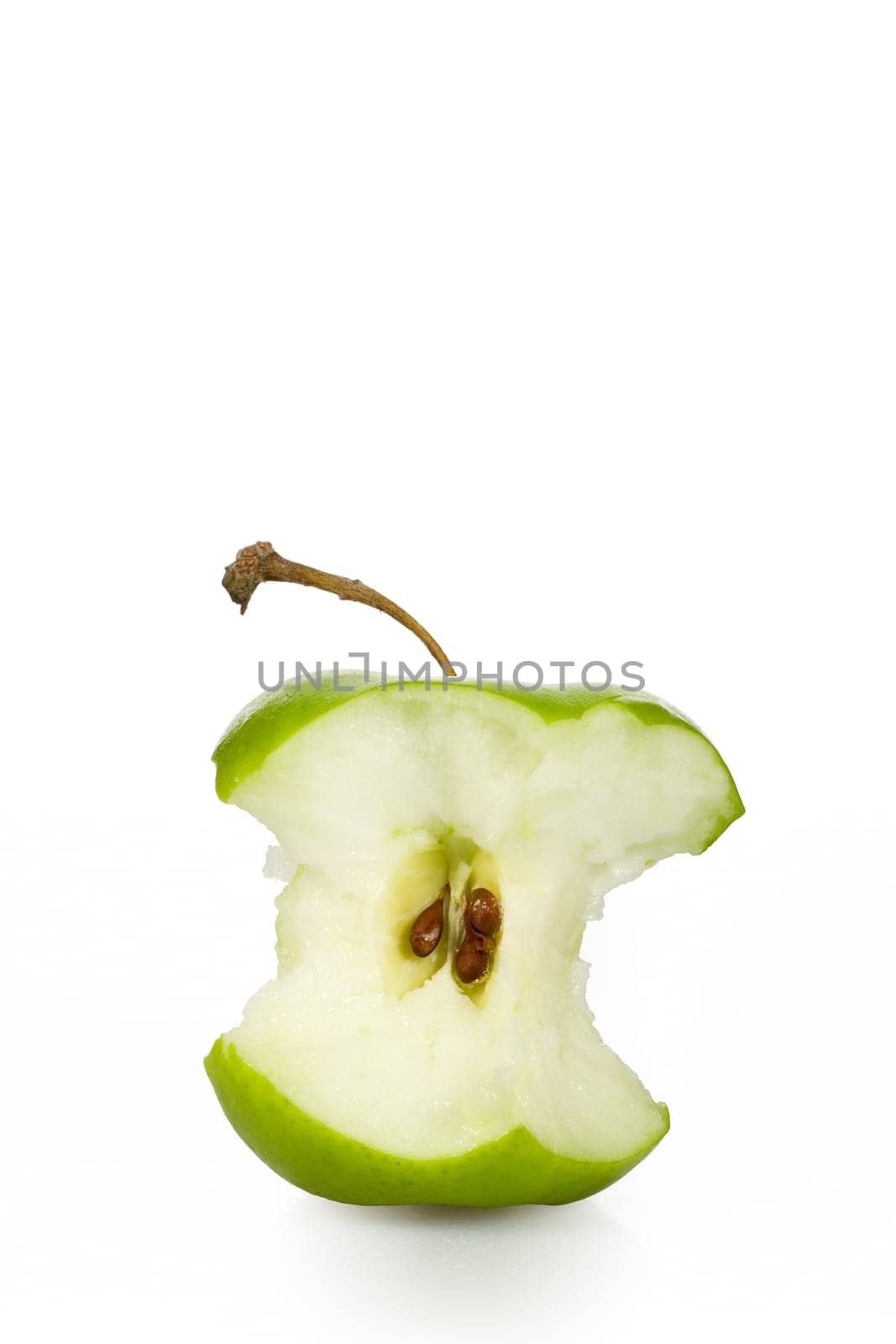 Green apple core over white - clipping