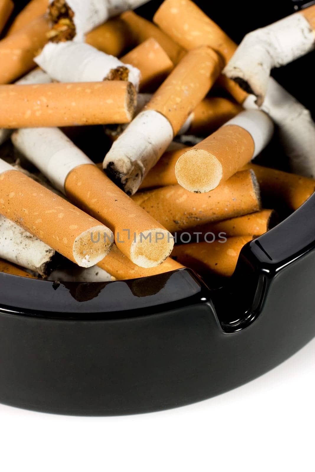 Close-up of cigarettes butts in ashtray