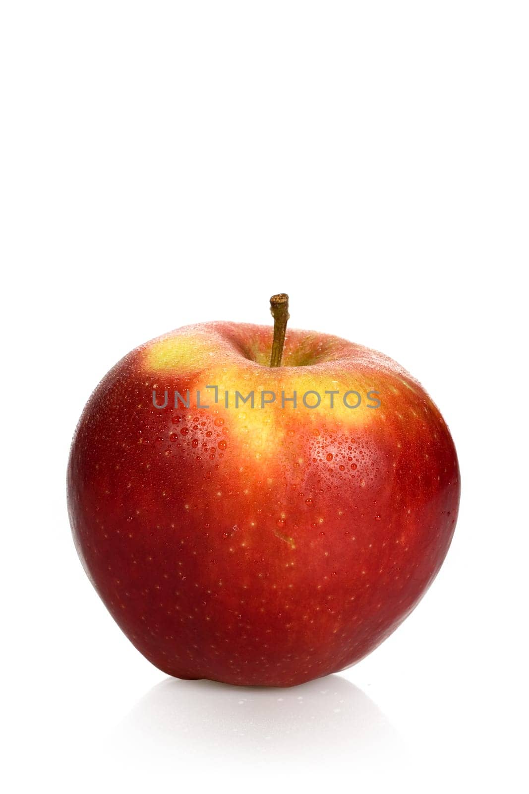 Wet red apple on - with clipping path