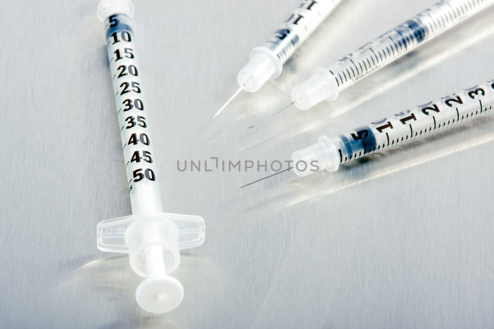 Four medical syringes