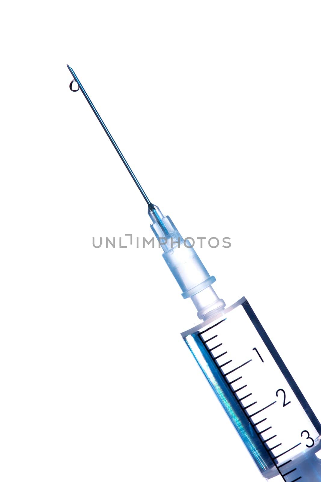 Drop of a liquid on a needle of syringe
