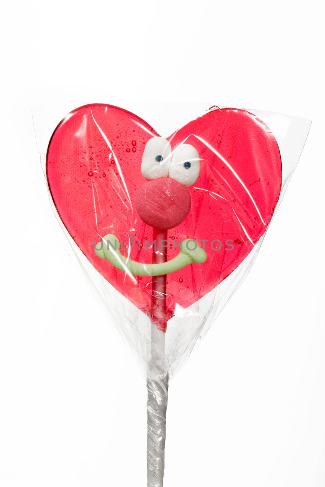 Candy red heart isolated over white