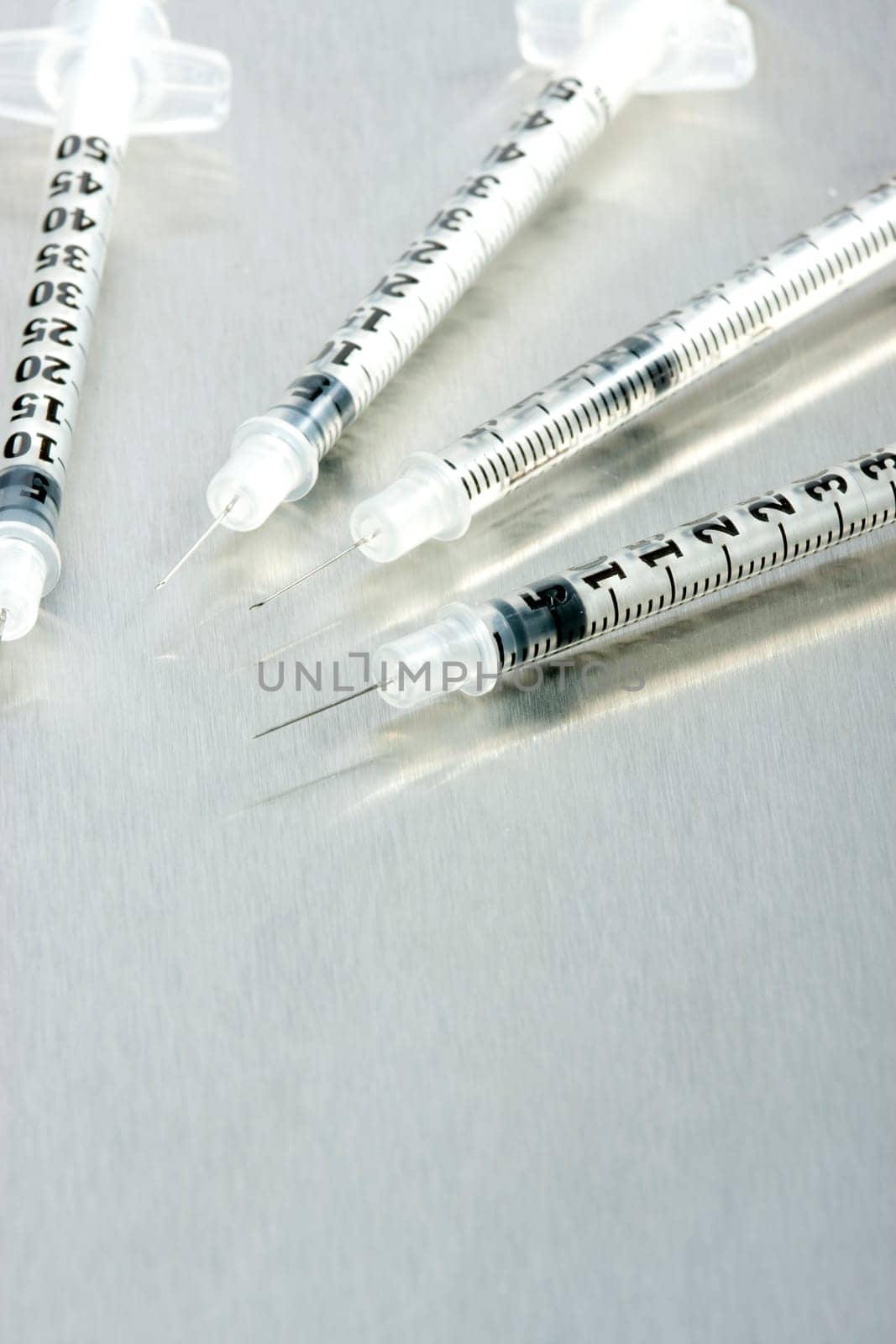 Four medical syringes