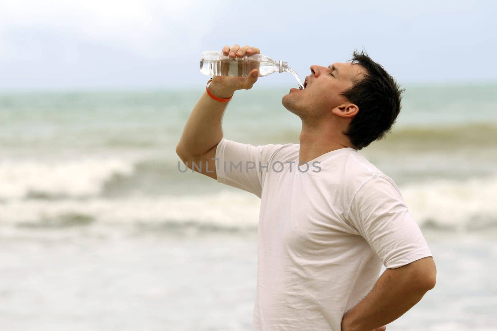 man drinks water