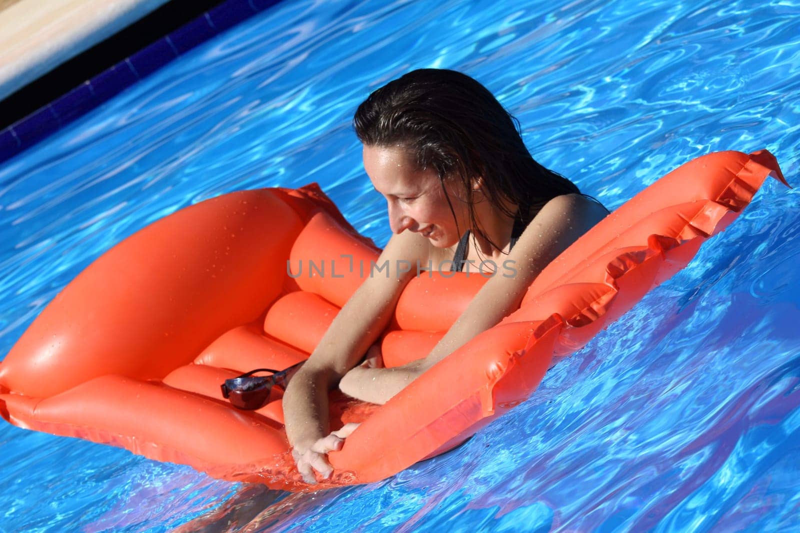 Woman floating on air mattress