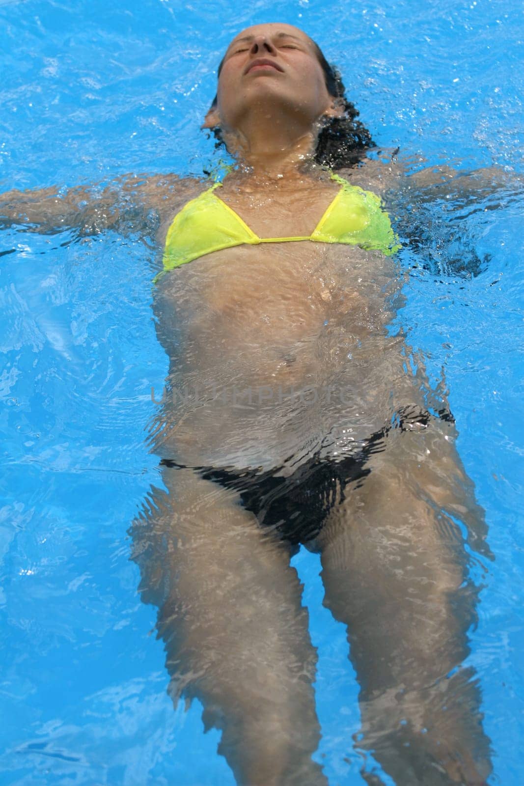 Woman swimming in outdoor pool