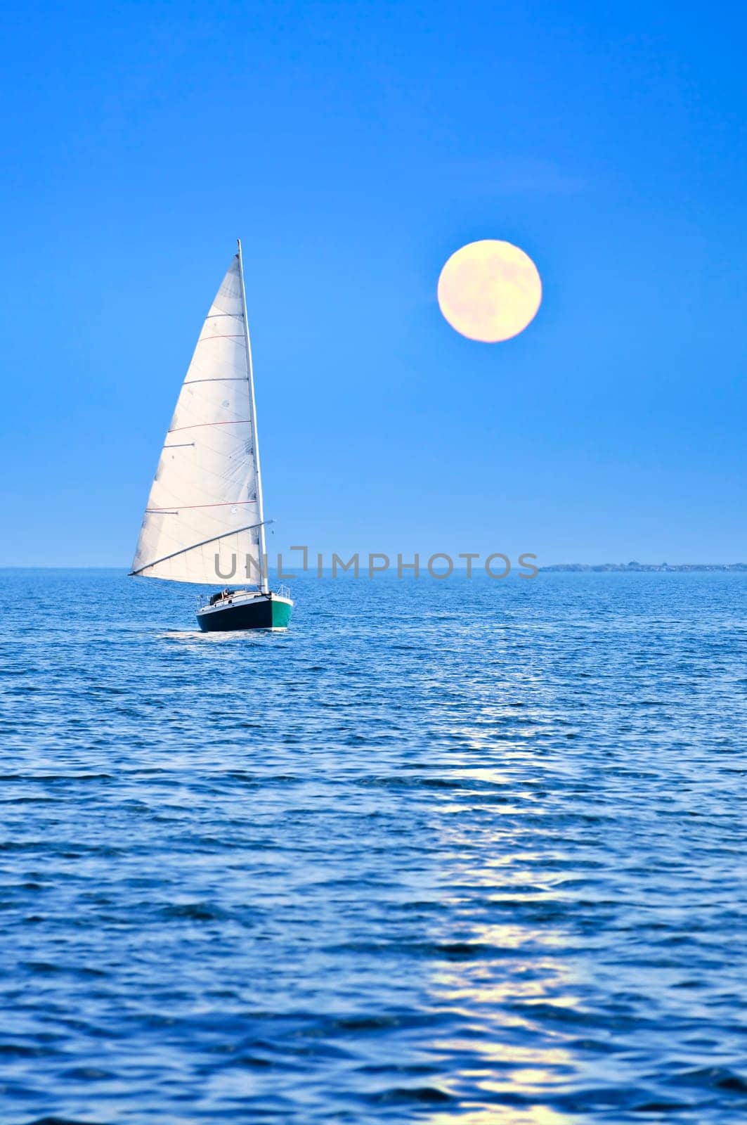 Sailboat at full moon