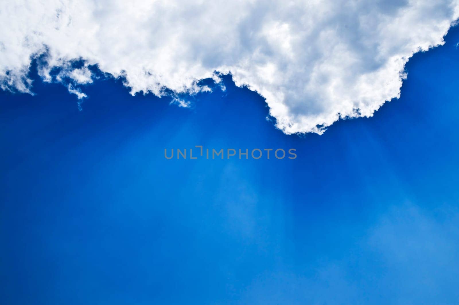 Blue sky with sunrays