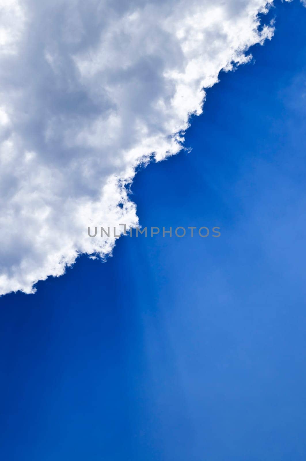 Blue sky with sunrays