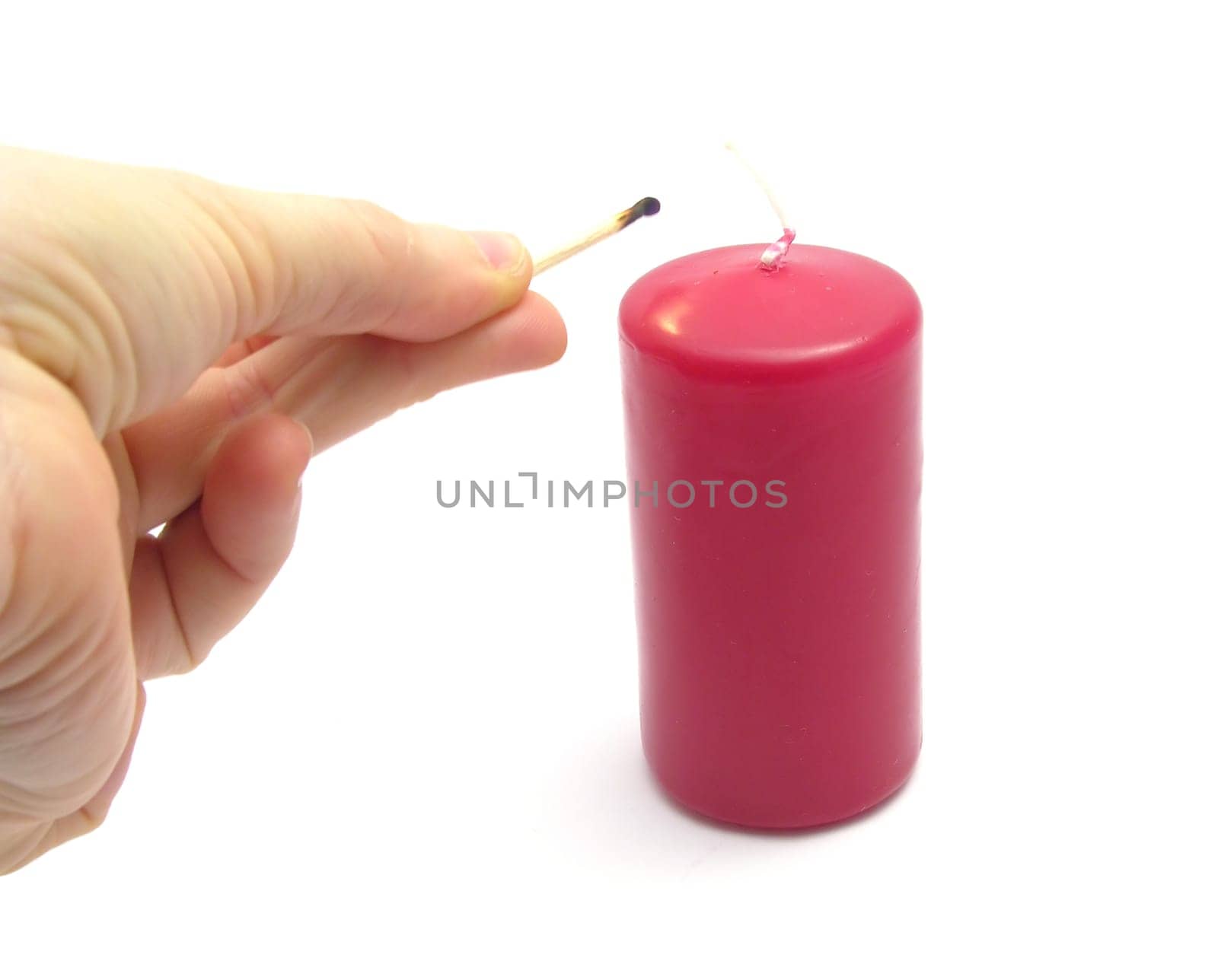 Hand,burnt match and candle