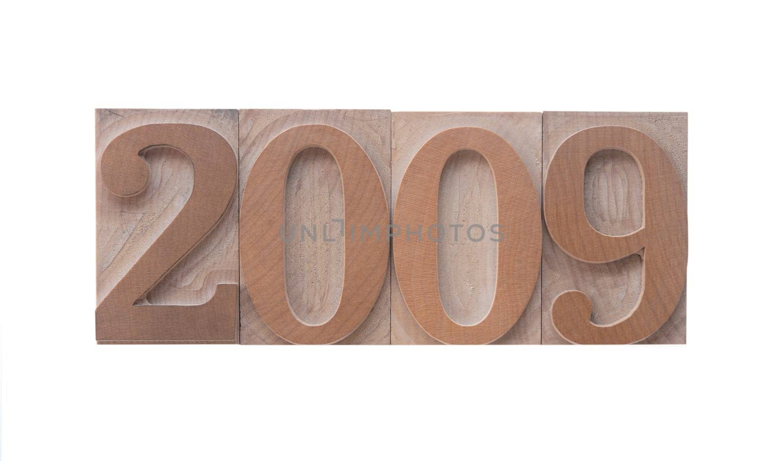 2009 in old ink-stained wood type