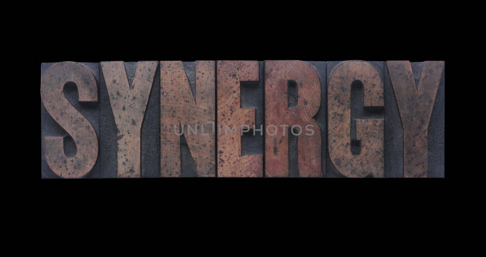 synergy in old ink-stained wood type