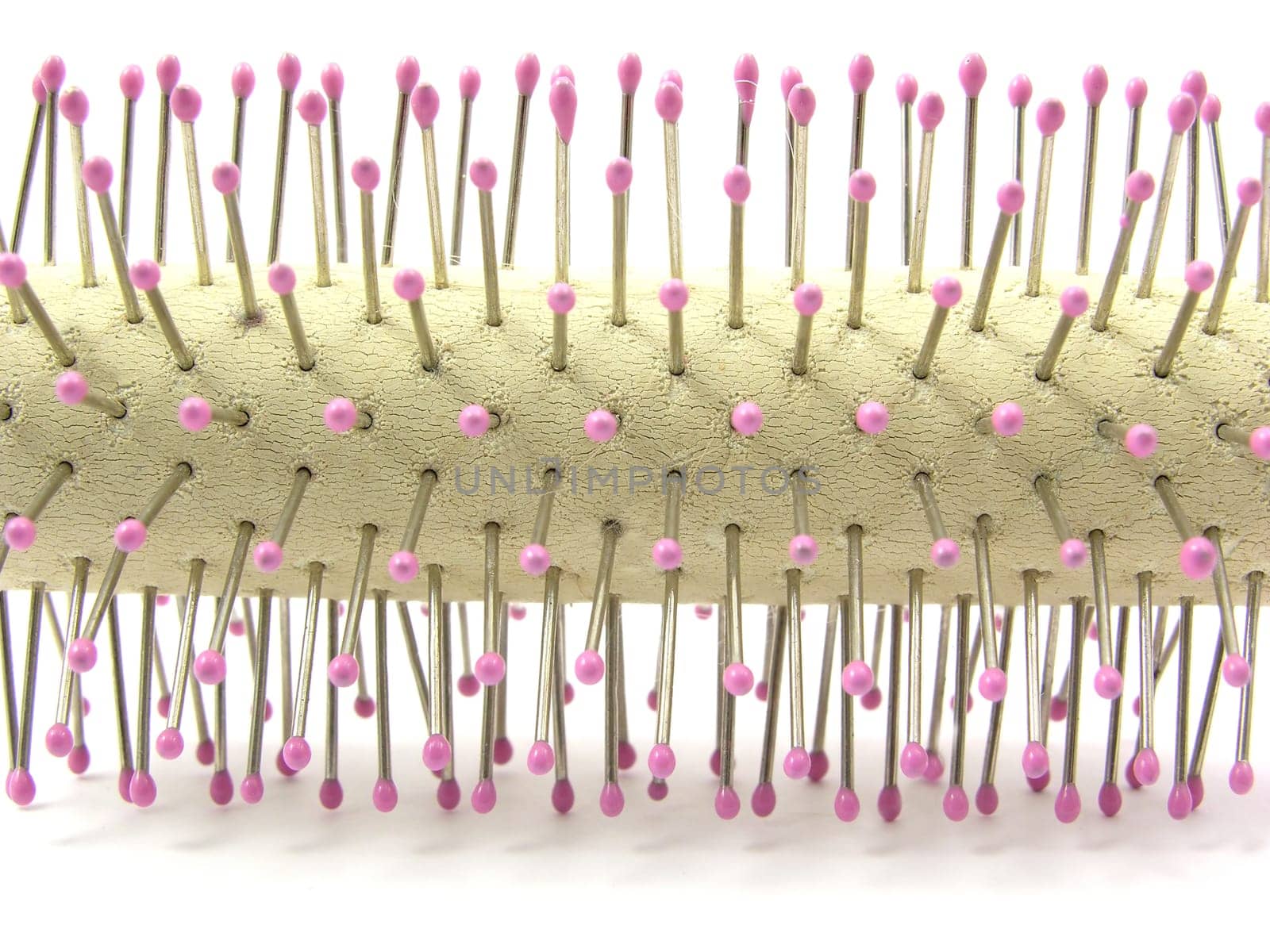 Close-up of a round brush on a white background