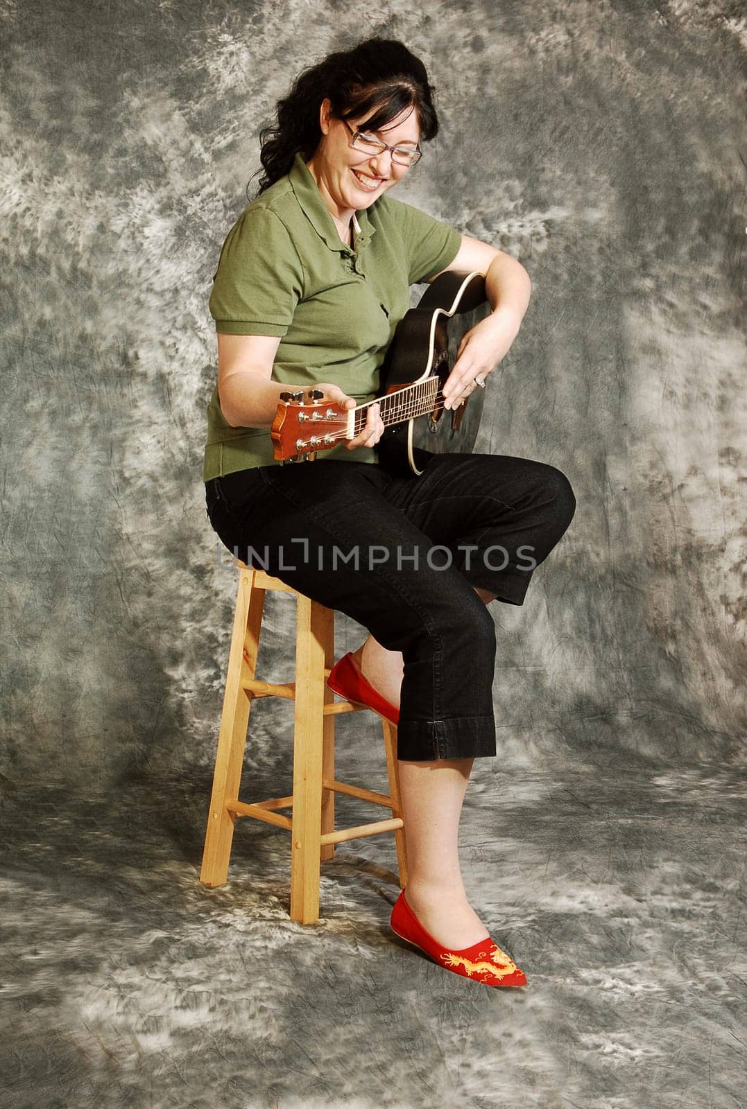 Woman with guitar.