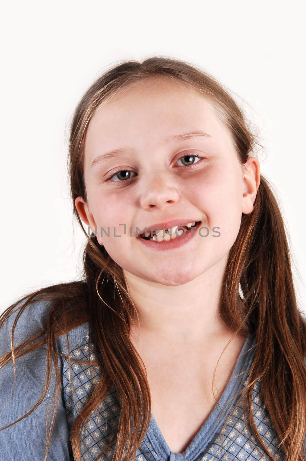 Young girl with missing teethes.