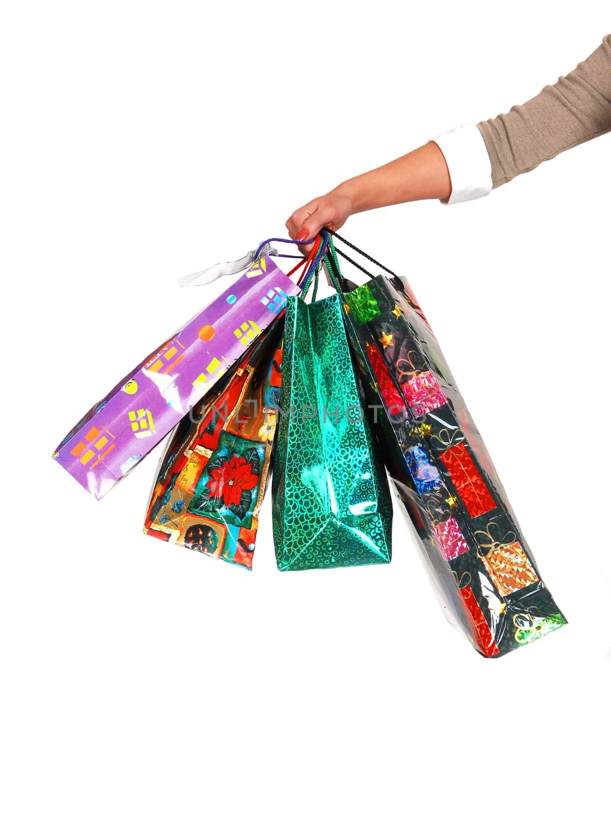 The arm of a woman with shoping bags.