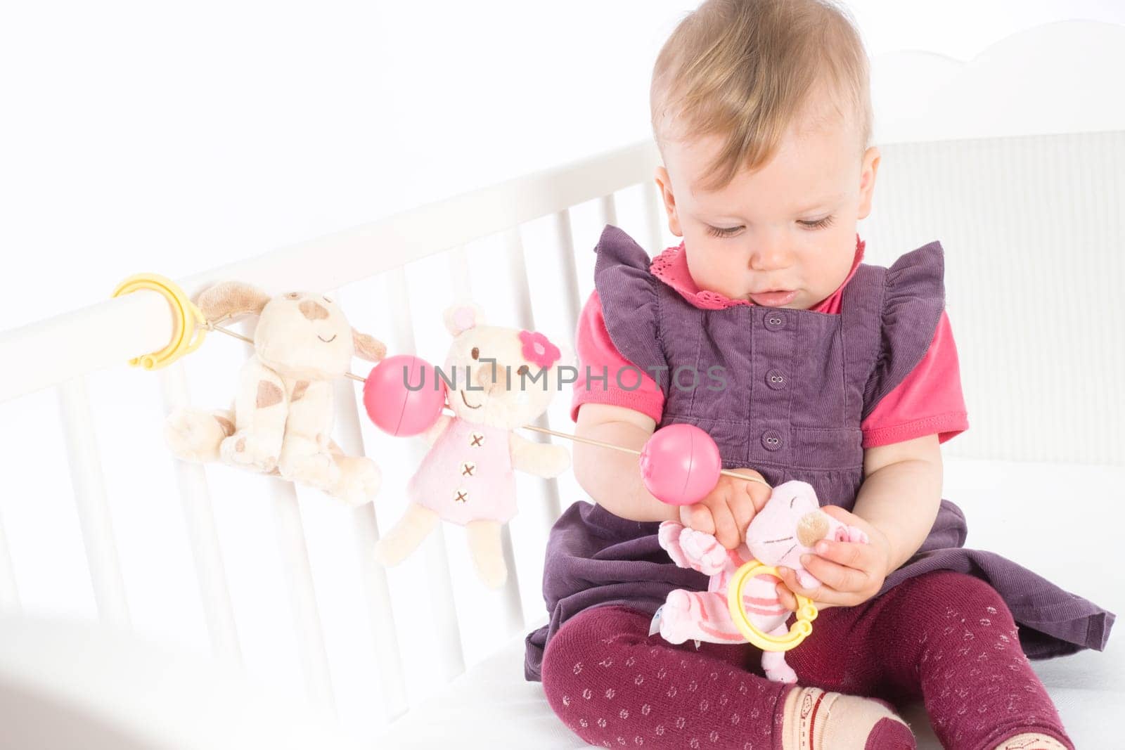 Baby Girl playing in bed