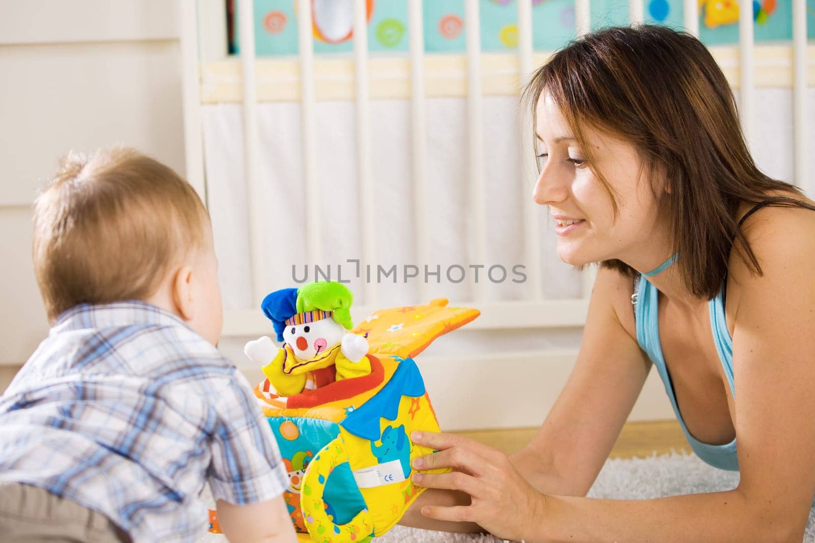 Baby and mother playing