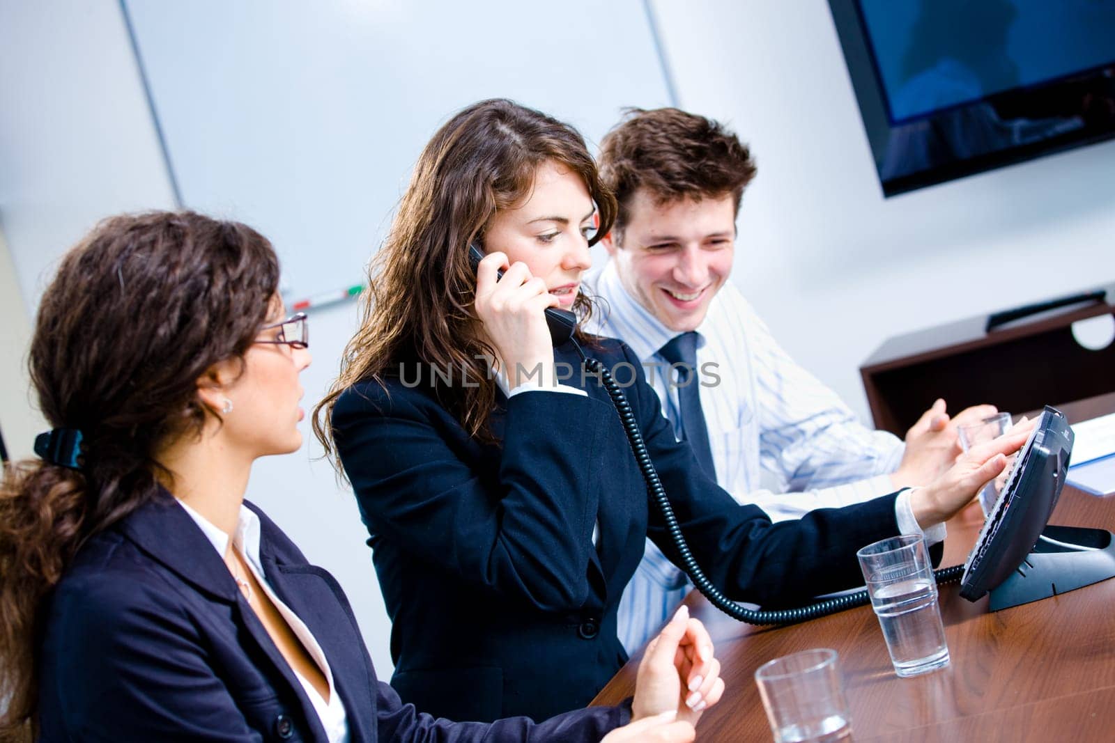 Businesspeople calling on phone