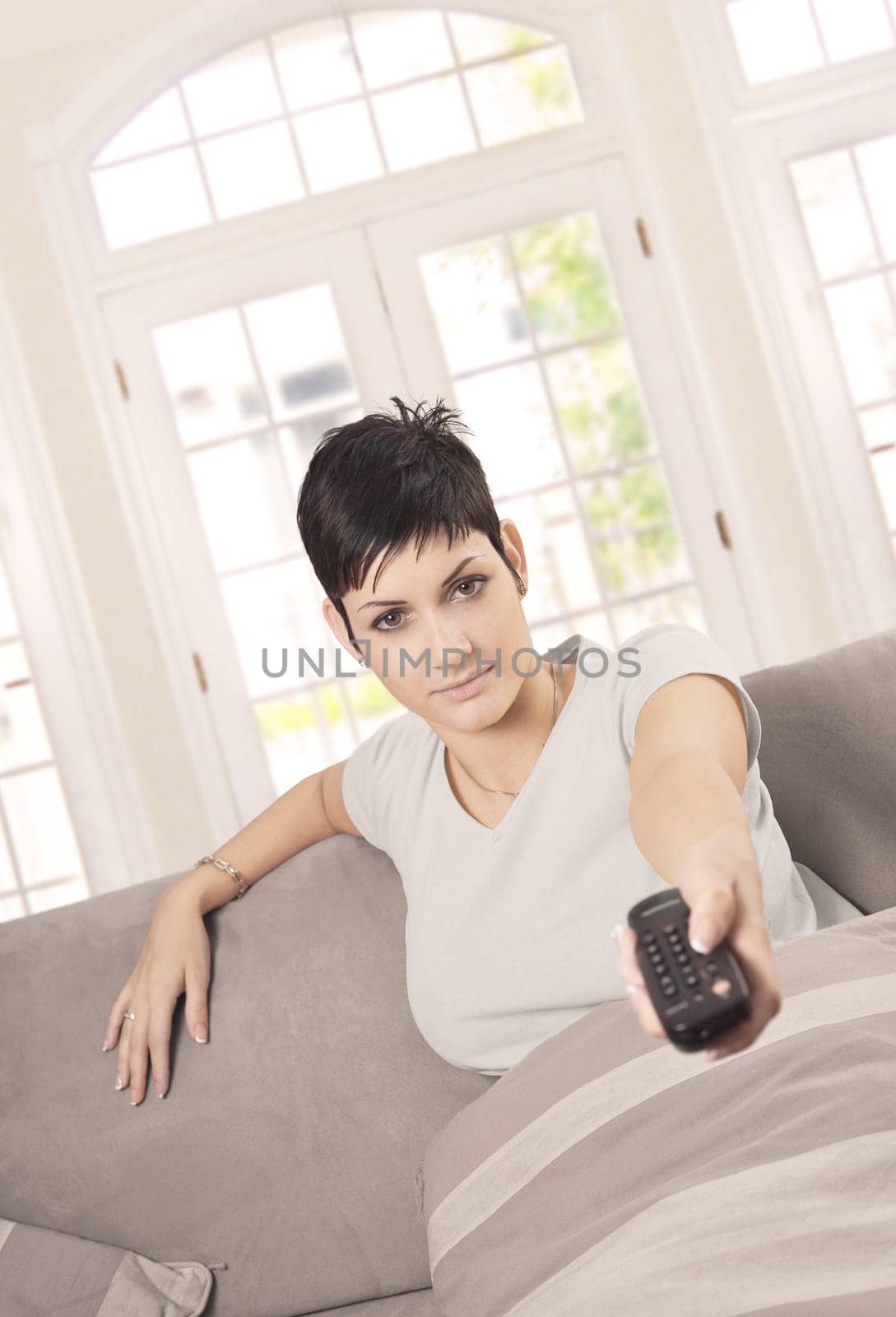 Young woman watching TV