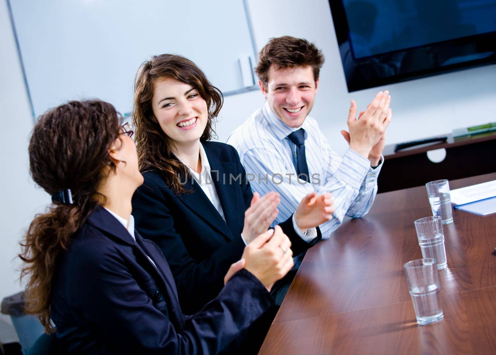 Clapping businesspeople