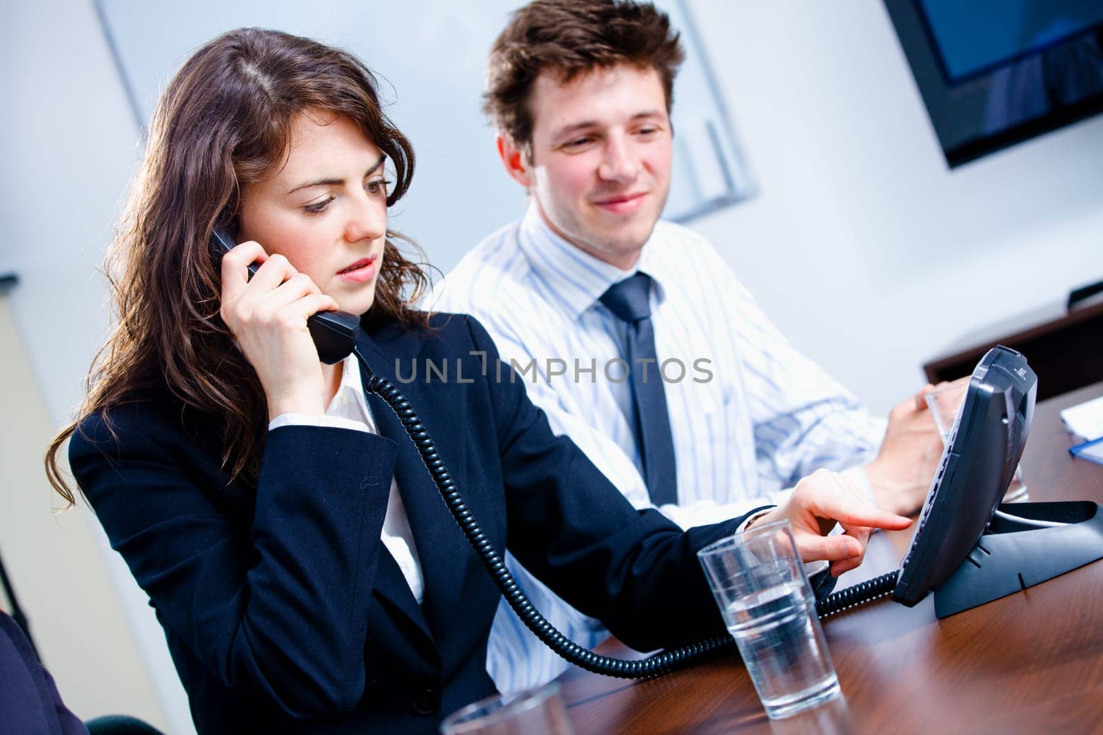 Businesspeople calling on phone