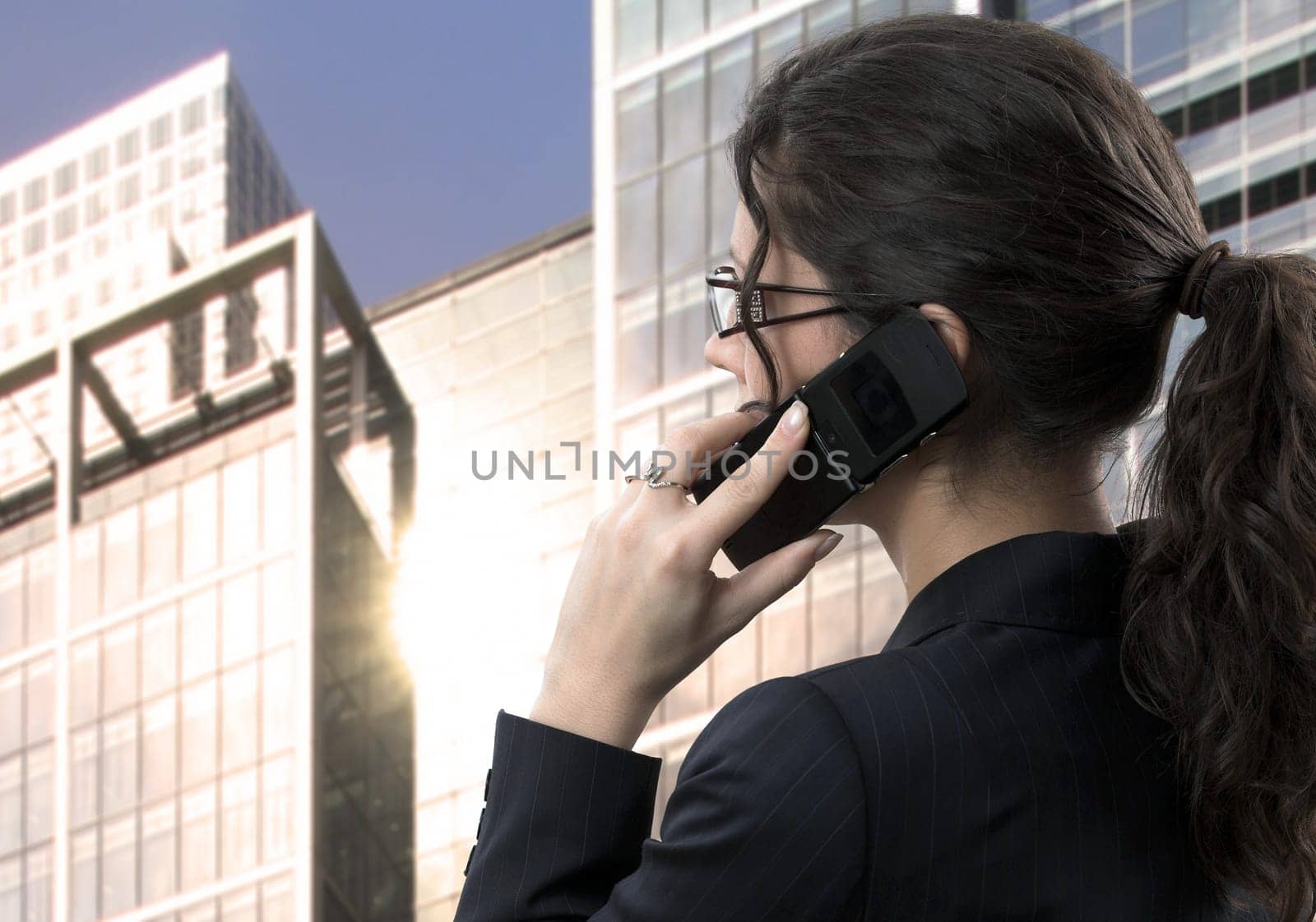 Young businesswoman talks on mobile