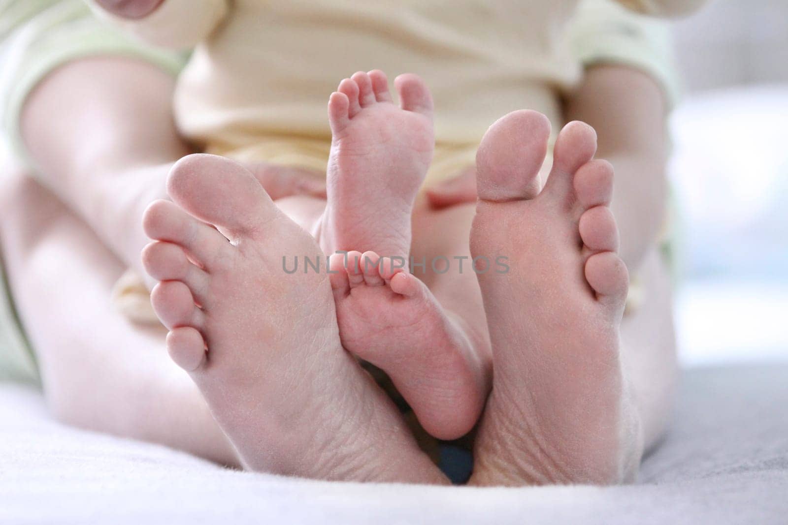 small childrens and adult mother foot