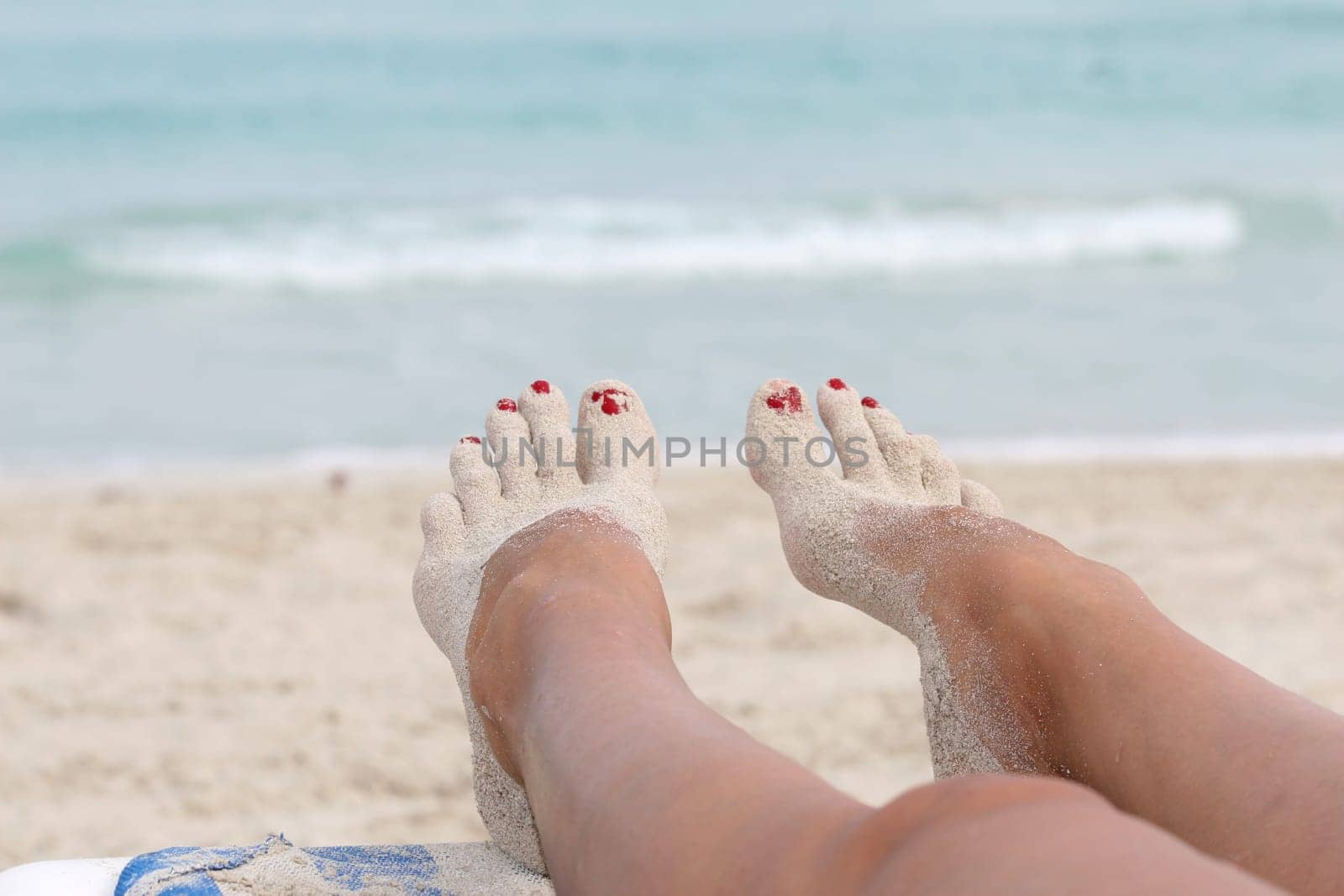 Woman's feet in the sand