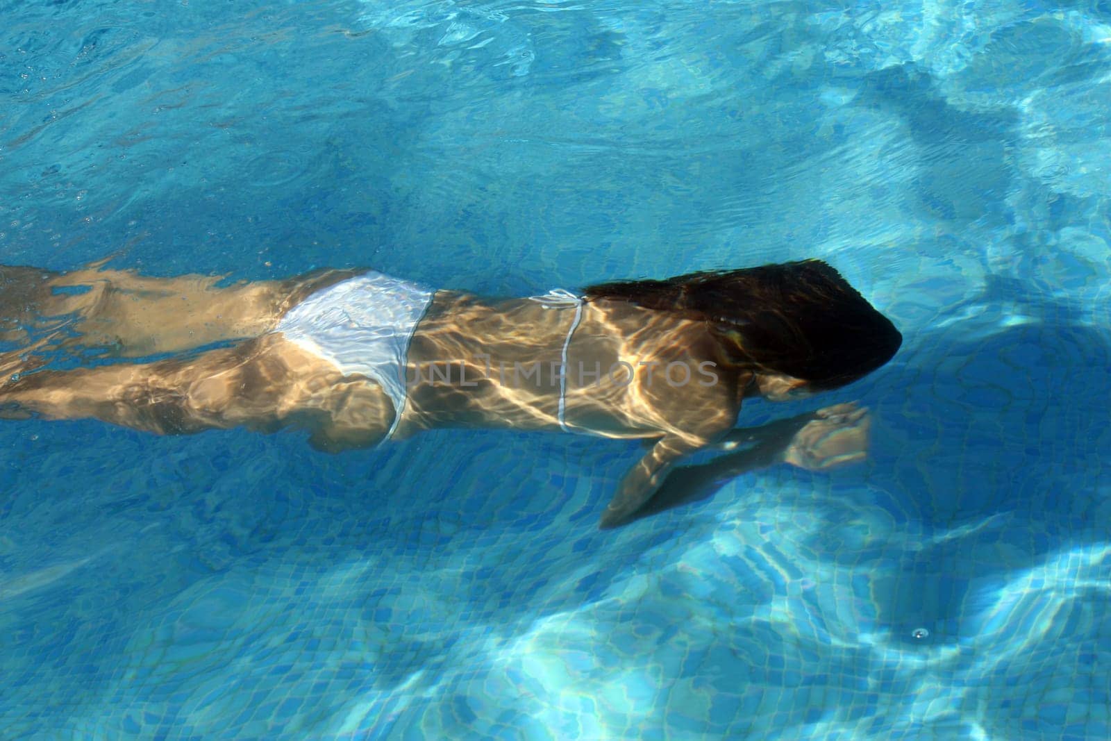 Woman swims underwater