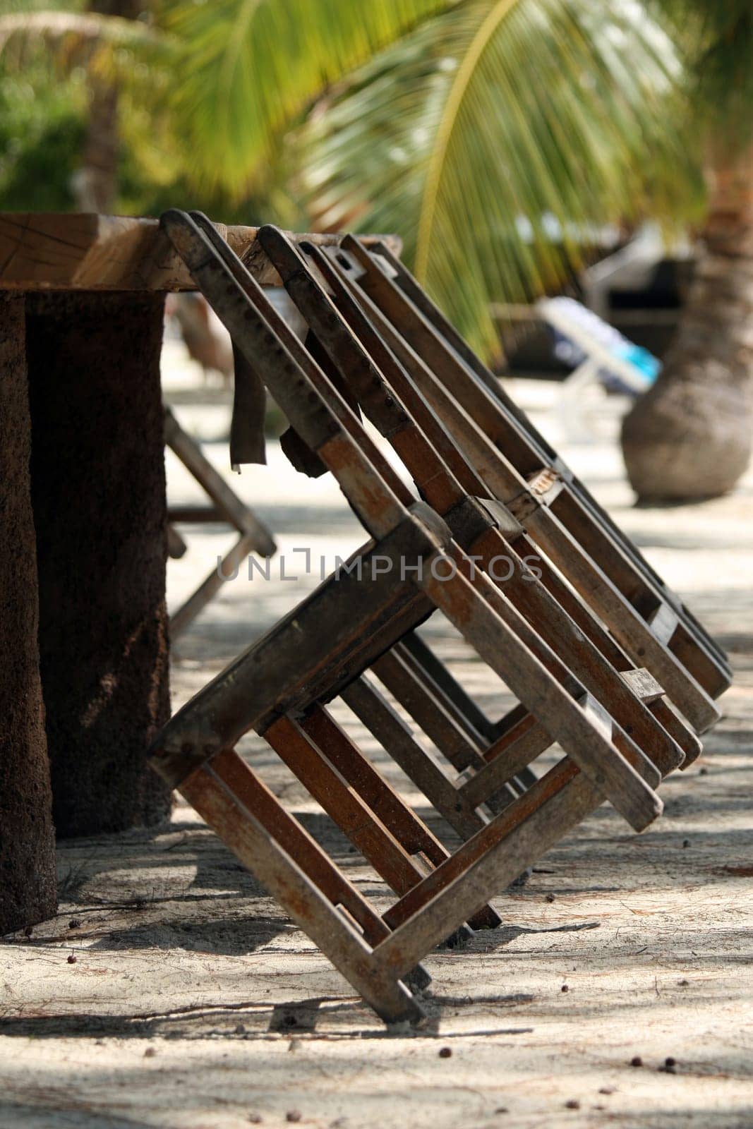 Table and chairs on the beach