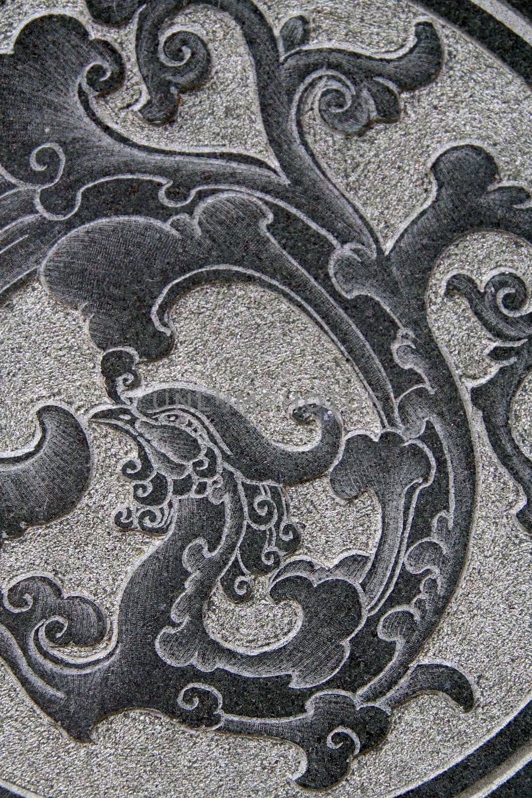 Asian pattern on a stone wall