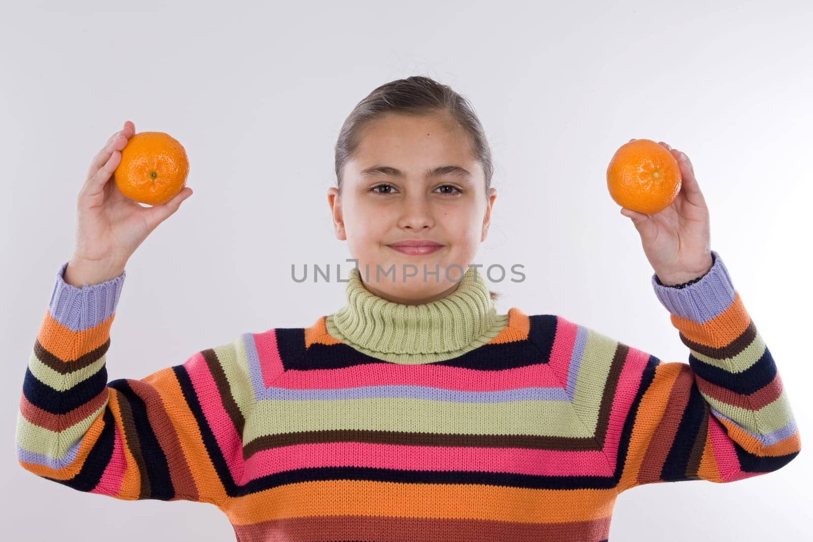 Attractive girl with mandarines