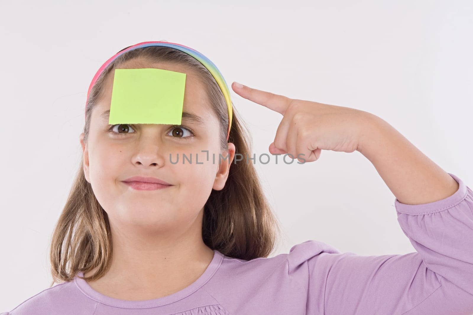 Adorable girl squint with post-it