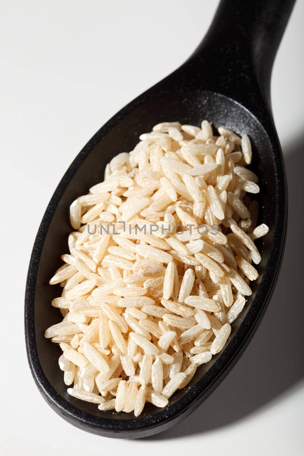 Brown rice on spoon