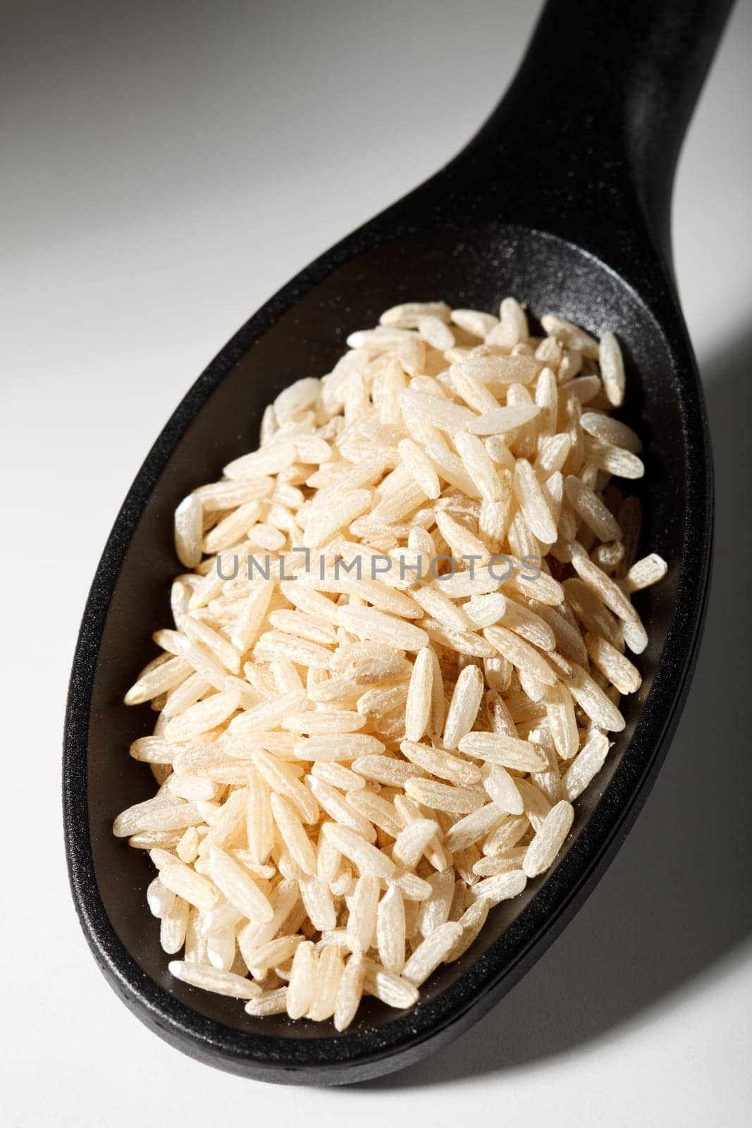 Brown rice on spoon shade