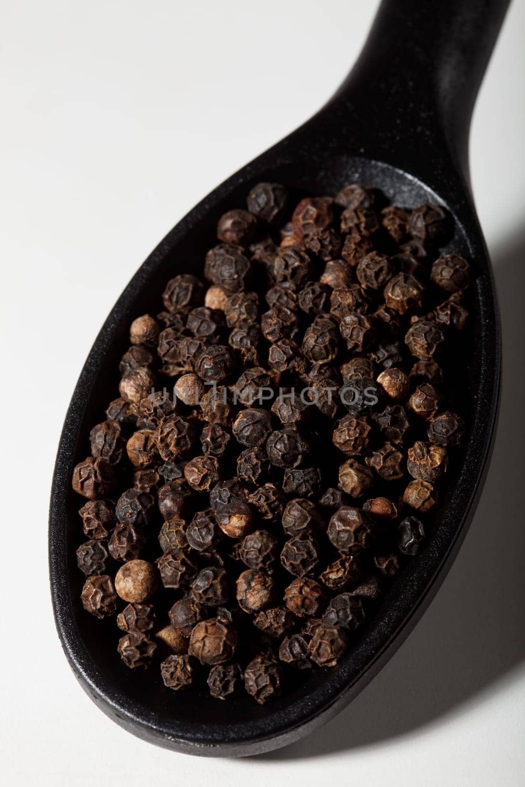 Black pepper on spoon