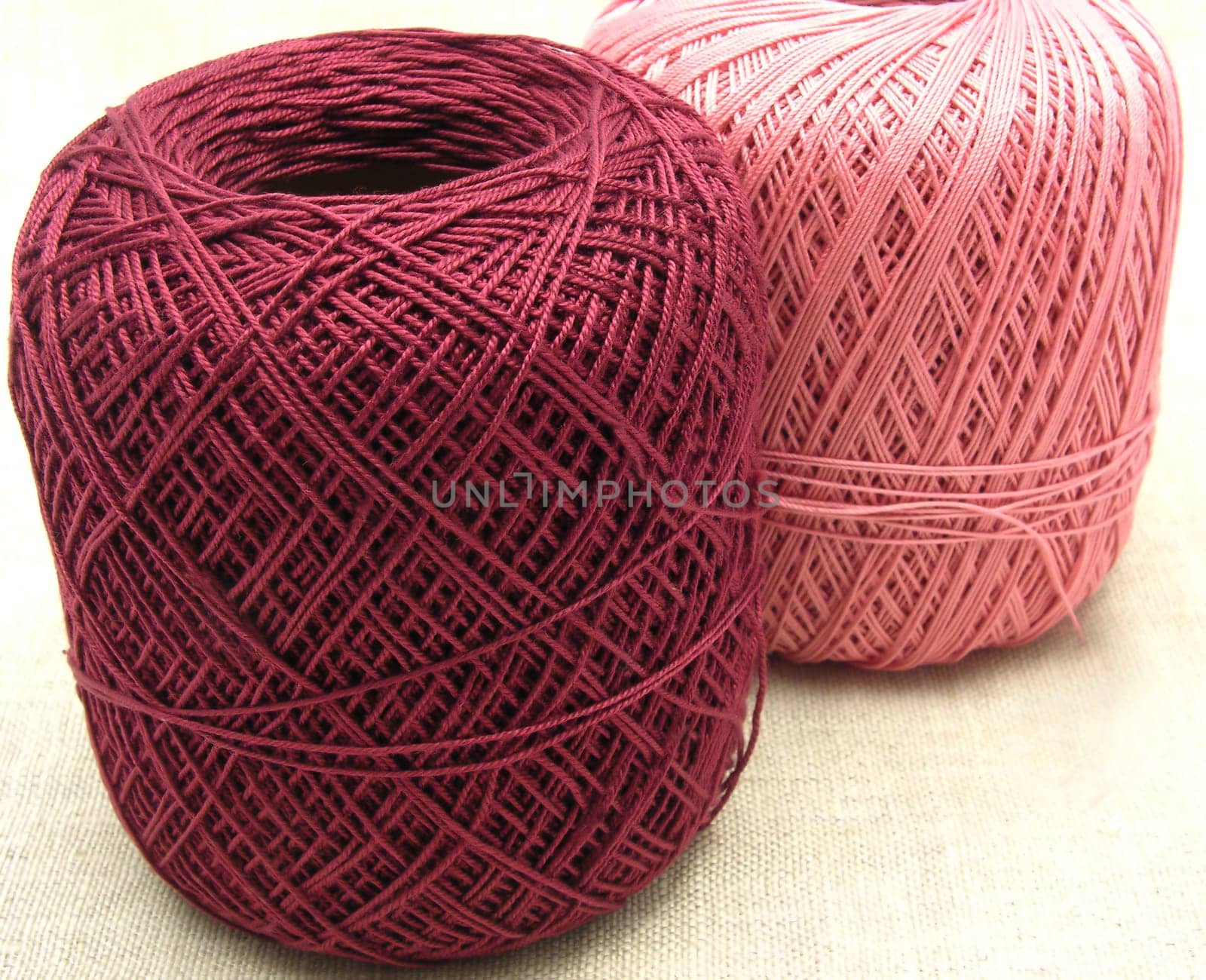 Balls of wool on a beige background