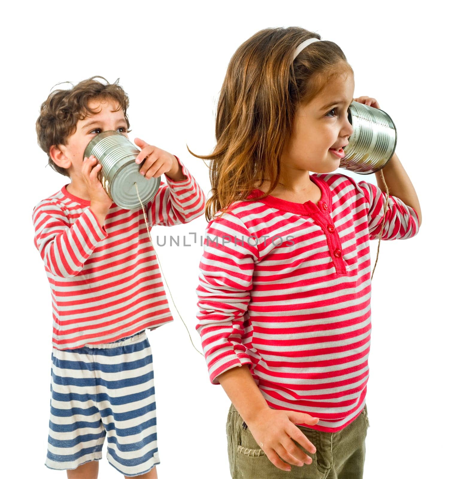 two kids talking on a tin phone