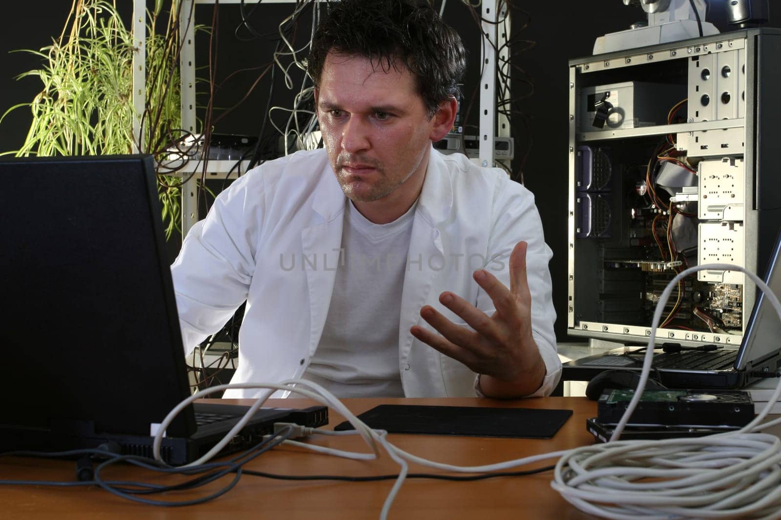 Technician sweating on computer