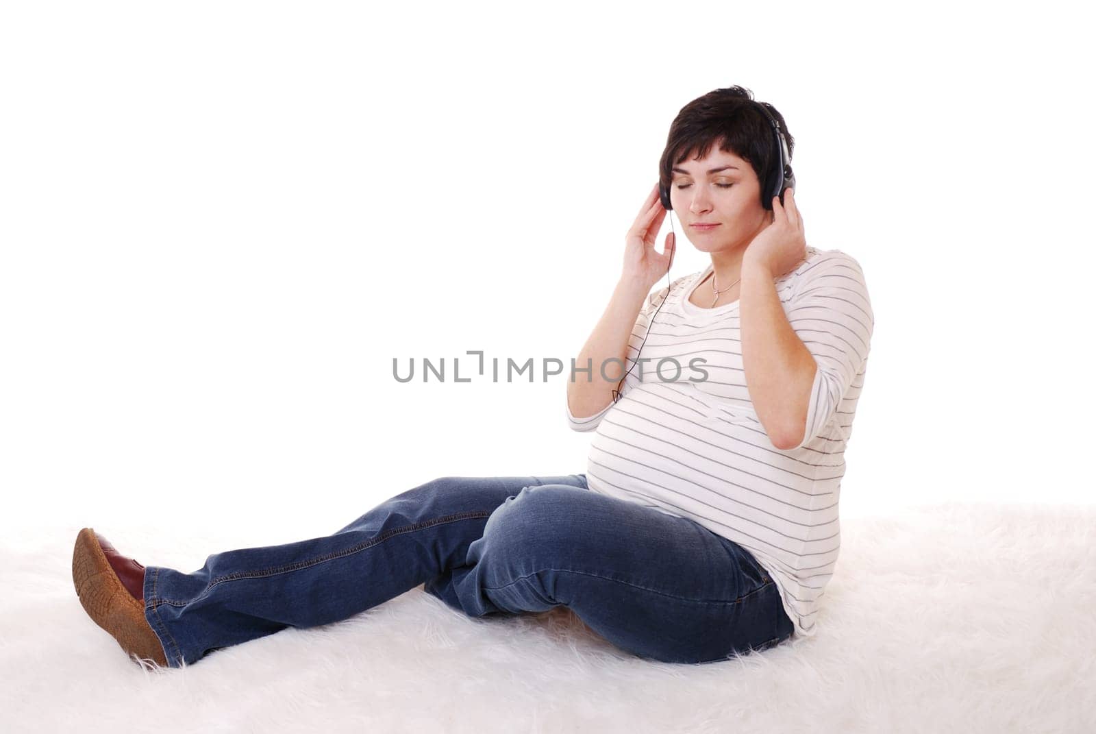 Pregnant woman listens to music