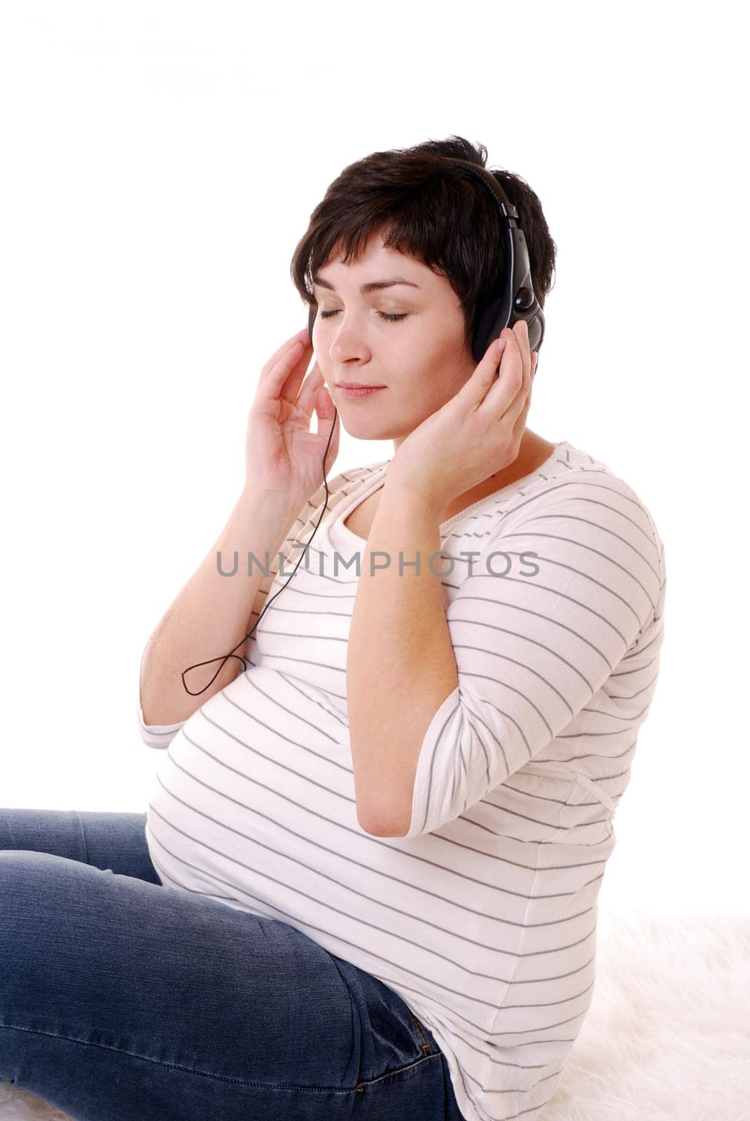 Pregnant woman listens to music