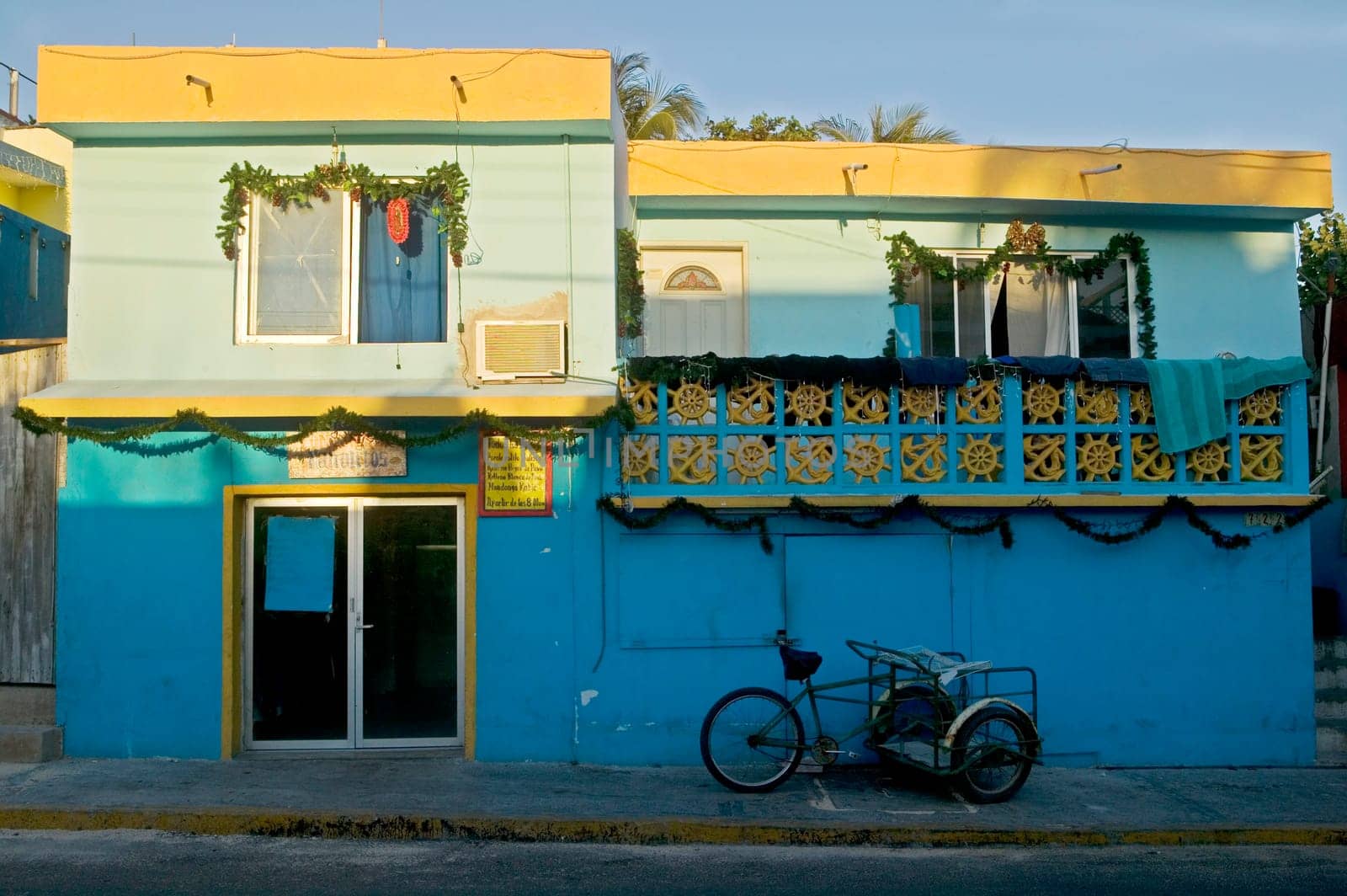 Pedal cart and festive Building at Sunse