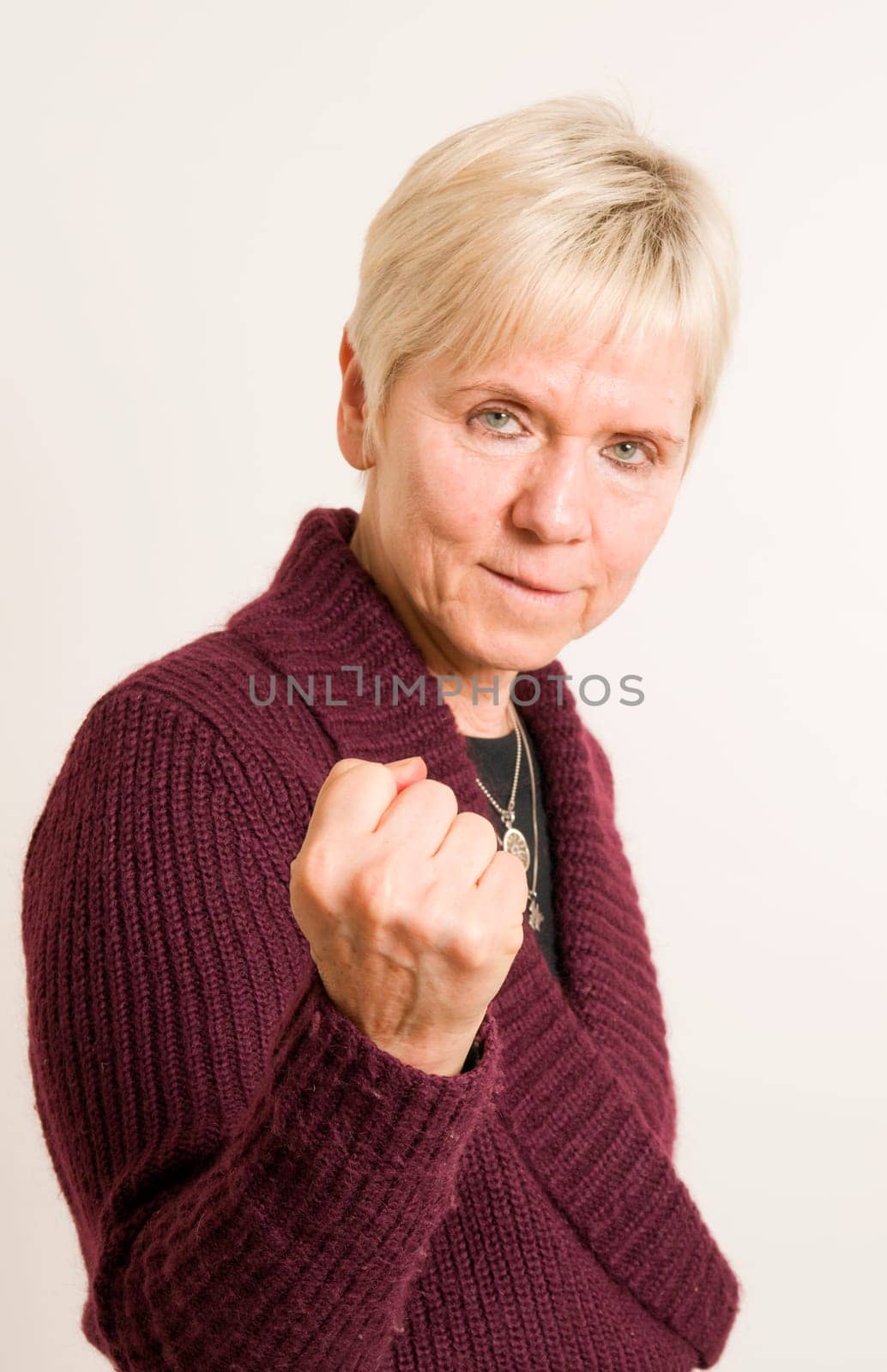 mature woman show the fist