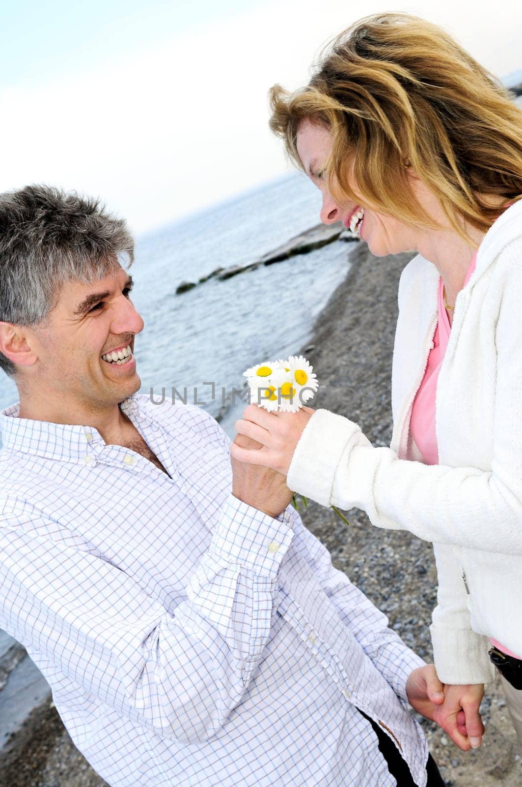 Mature romantic couple with flowers