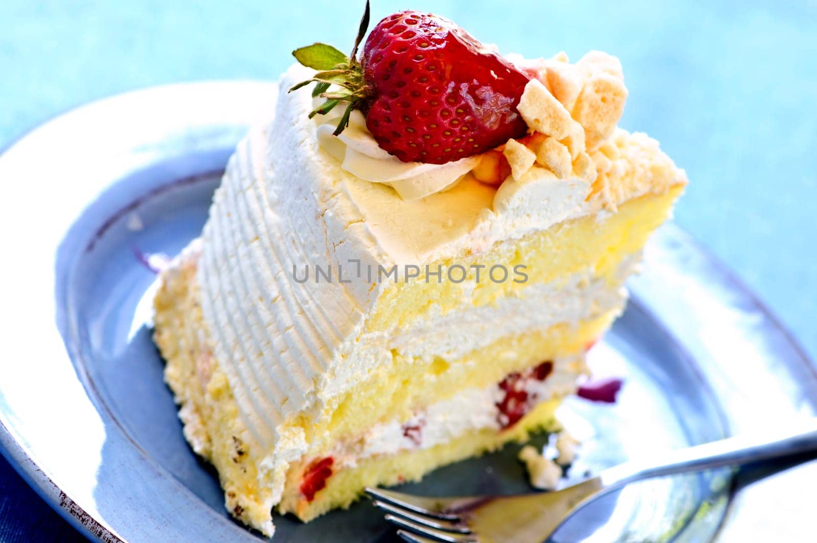 Slice of strawberry meringue cake