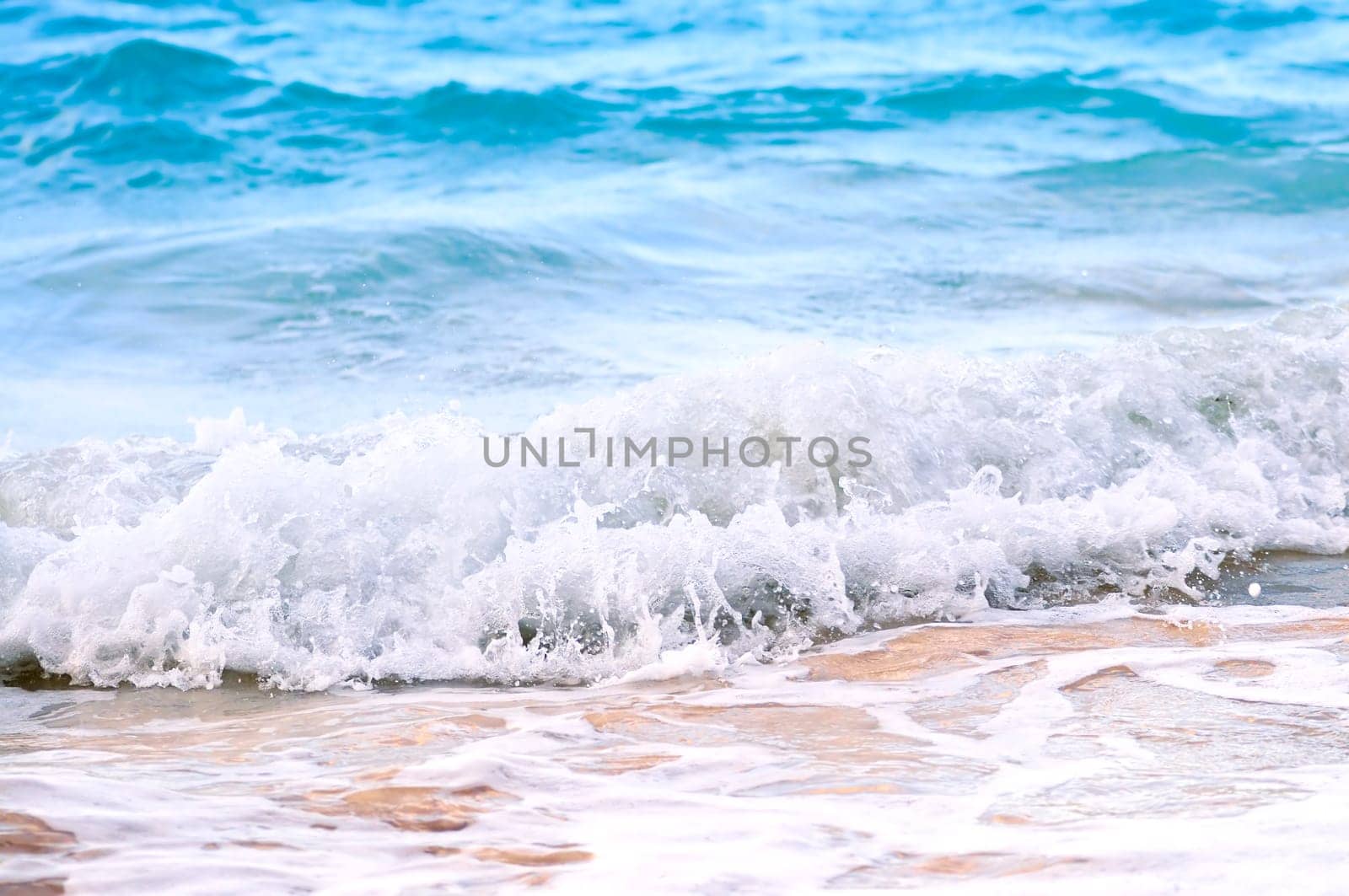 Waves breaking on tropical shore